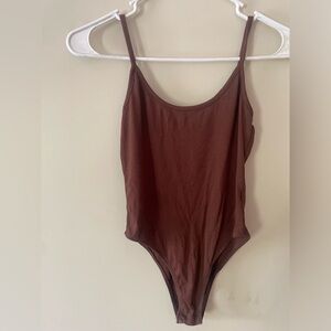 brown bodysuit